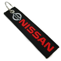 Брелок тканевый с вышивкой «Nissan»